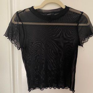 black mesh shirt with lettuce trim.